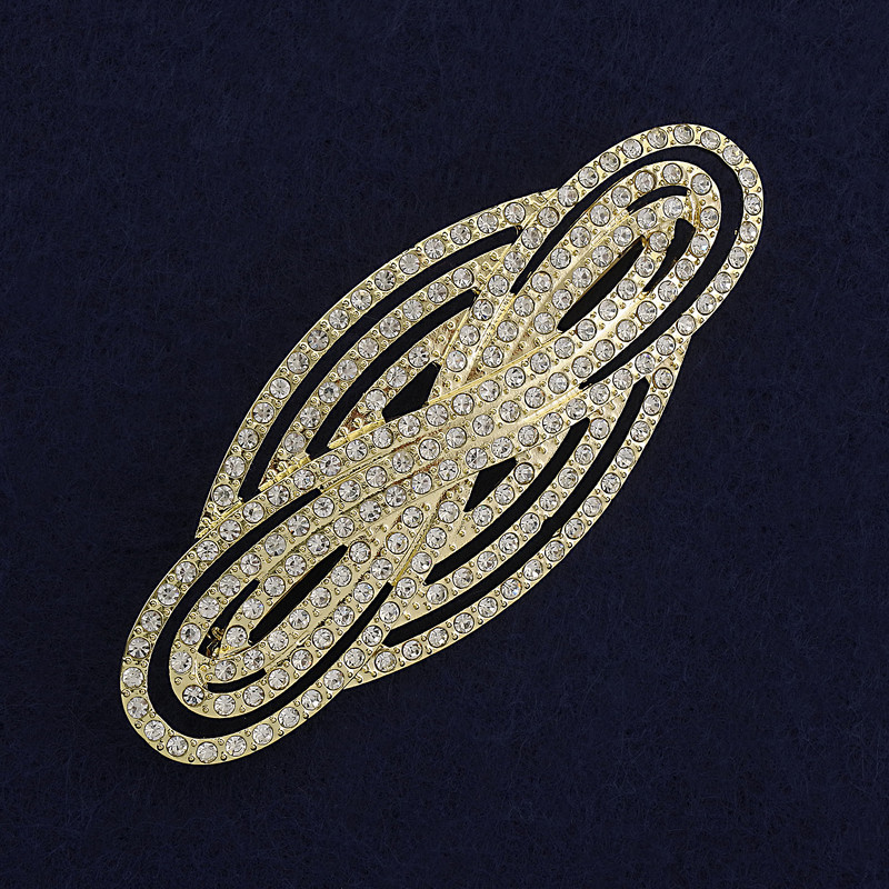 Brooch 'Accent' with white rhinestones on gold-toned metal 80x33mm+