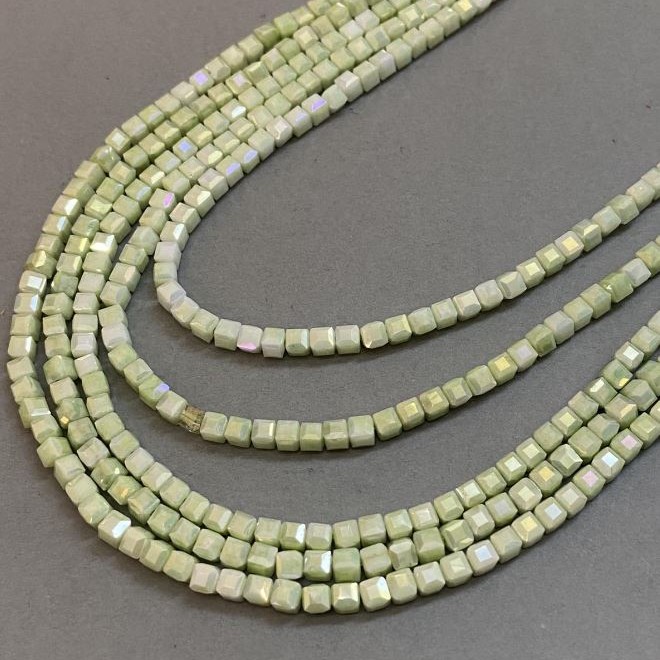 Beads Czech Crystal Chartreuse with petrol coating on thread, faceted cube, diameter 4x4 mm, length 38 cm