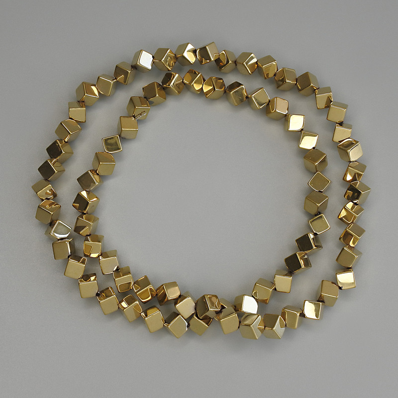 Hematite beads, gold-colored cube with through hole 4x4 mm +/- on a beading thread, length 38 cm+