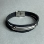 Black bracelet with metal inserts and a clasp, length 21 cm+