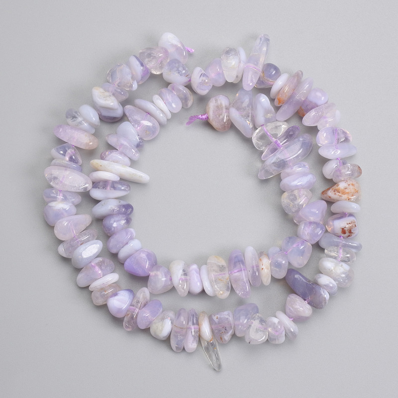 Sapphireine faceted beads 7–20×3–6 mm ±, length about 39 cm on a thread