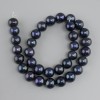 River pearls graphite with peacock iridescence (peacock black), diameter 11–12 mm ±, length 37 cm ± on a thread