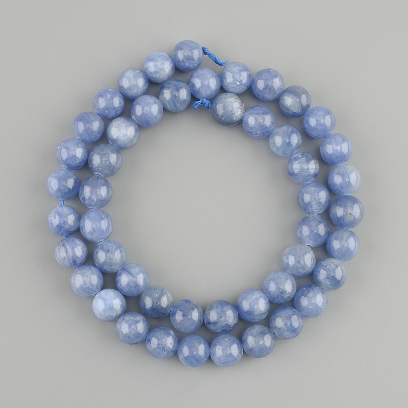 Beads of natural kyanite — smooth round beads, diameter 8.5 mm, length about 39 cm on a thread