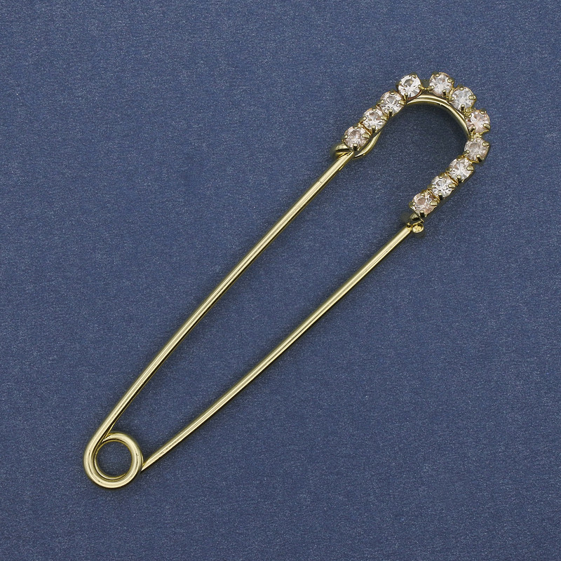 Brooch pin with white rhinestones, golden metal, 70×16 mm ±