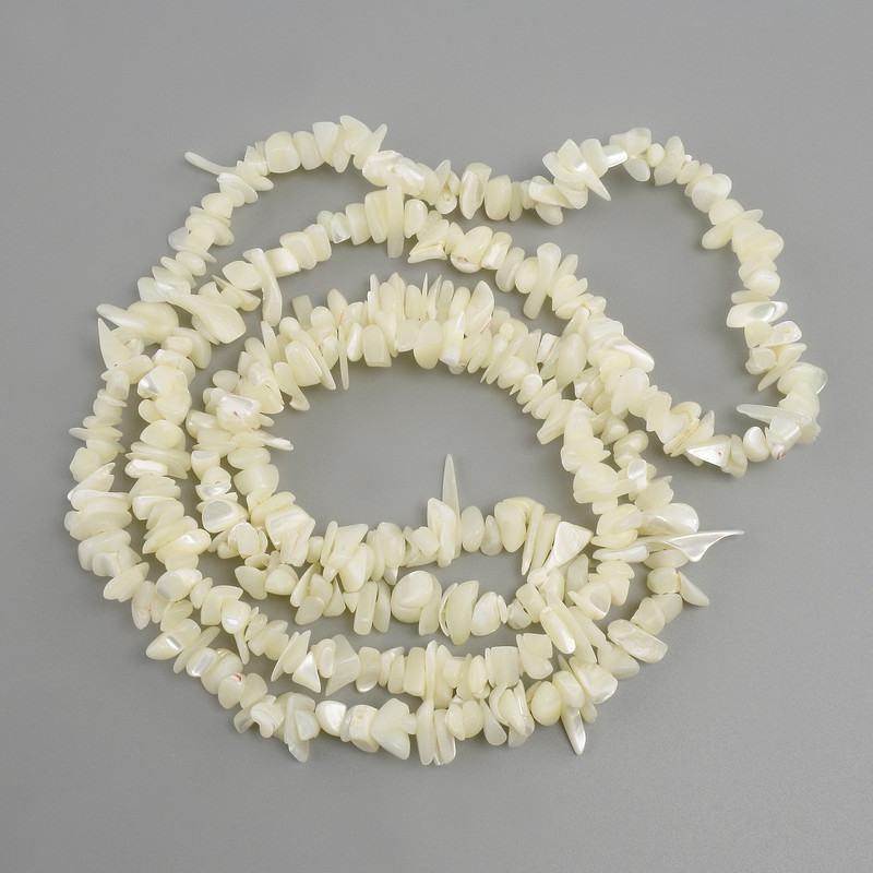 Mother-of-pearl chip beads, 6–10×1–3 mm, approximately 84 cm long on thread