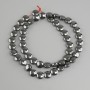Hematite coin beads, 8 mm diameter, approximately 41 cm long, on beading wire
