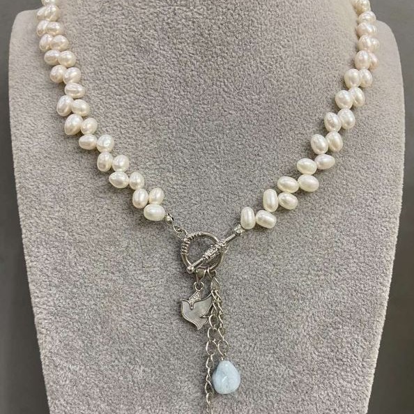 Necklace of river pearls, oval shape with butterfly pendant, diameter 6.5–7.5×4.5–5mm ±, with additional pendants, length 50 cm + toggle