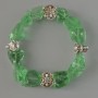 Bracelet Quartz toned green unpolished stone faceted, diameter 10x13mm+ -, length 18cm + - (stretch) with metal inserts