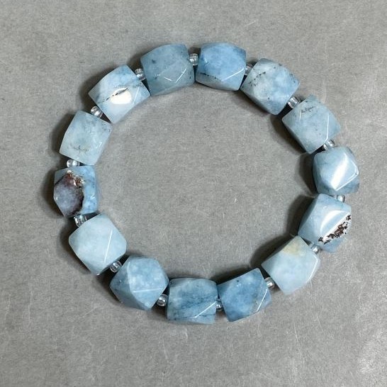 Aquamarine bracelet faceted, diameter 12×10–11 mm ± bead 3 mm ±, length 18 cm ± stretch