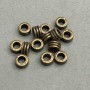 Bead Insert Hardware Metal Color Bronze, diameter 7x4 mm ± hole, diameter 3, 6 mm ± ~50 pcs. +
