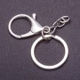 Price per pack / 10 pcs. Keychain base with two attachments: carabiner + ring, diameter 3 cm, length 5 cm