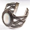 Wide pearl bracelet with metal bezel, oval setting