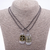 Twin pendant of friendship Love on a cord, length 45 cm, metal color 'silver and bronze'