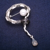 Snake-shaped enamel brooch with a bead and gray rhinestones, silver-tone metal 37×53 mm