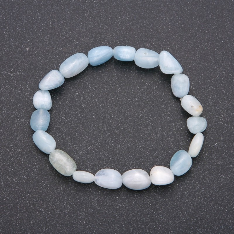 Bracelet made of natural aquamarine on elastic cord with guilloche, bead diameter 7x10(±)mm, circumference 18 cm