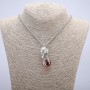 Pendant 'Bird with the Sphere' 47×18 mm on a chain, length 70 cm, silver-toned metal
