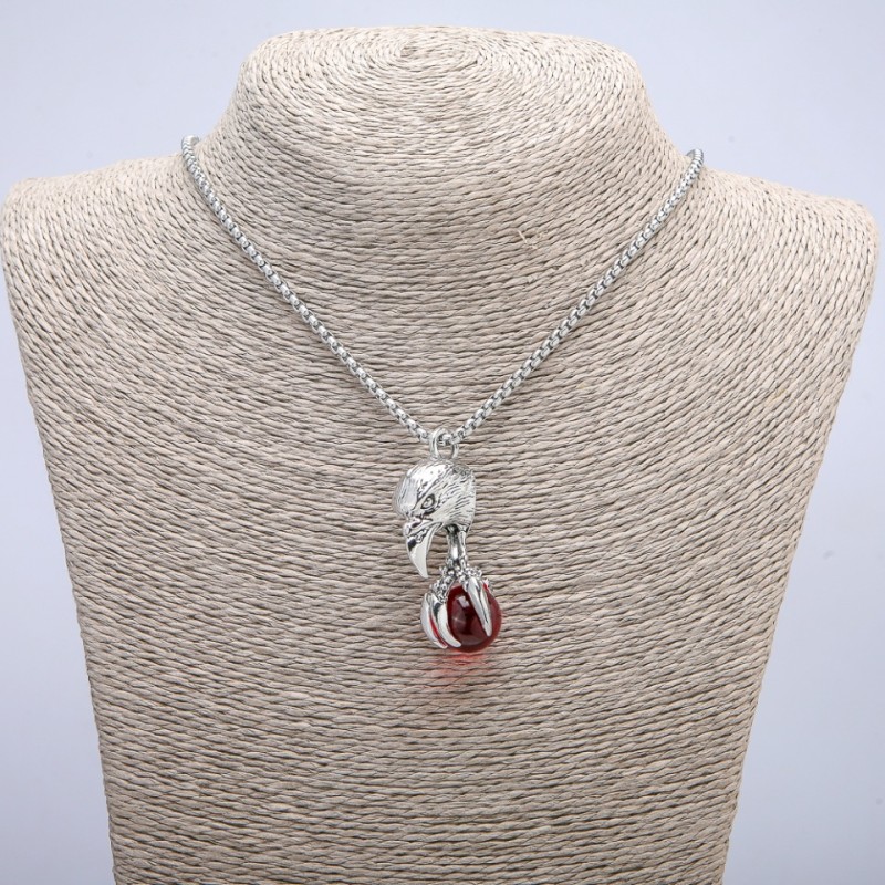 Pendant 'Bird with a Ball' 47×18 mm on a chain, length 70 cm, silver-toned metal