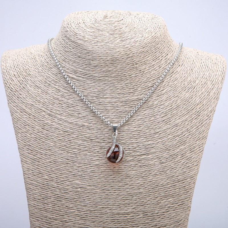 Pendant 'Ball in Paw' 35x17 mm on a chain, length 70 cm, silver-colored metal