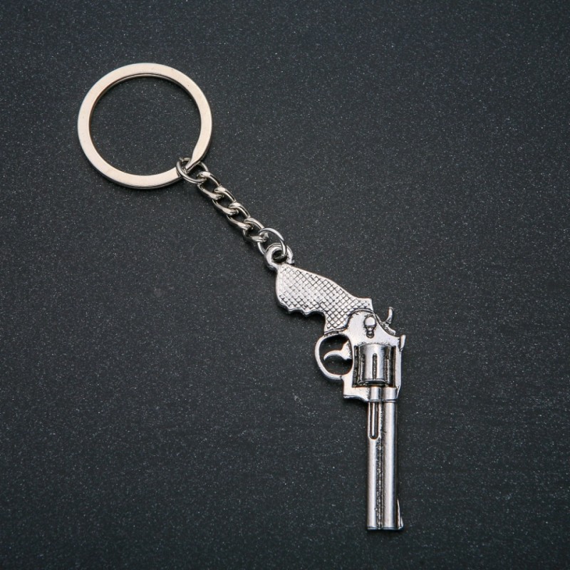 Keychain 'Revolver', diameter 62x28 mm, length 12 cm +/- silver-colored metal