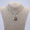 Pendant \"Dragon Eye\" in a bezel setting, 43×35 mm, on a chain, length 70 cm, silver-colored metal