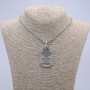Pendant 57x27 mm on chain, length 70 cm; silver-toned metal