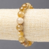 Elastic bracelet of natural Rutile Quartz with smooth beads, diameter 10± mm
