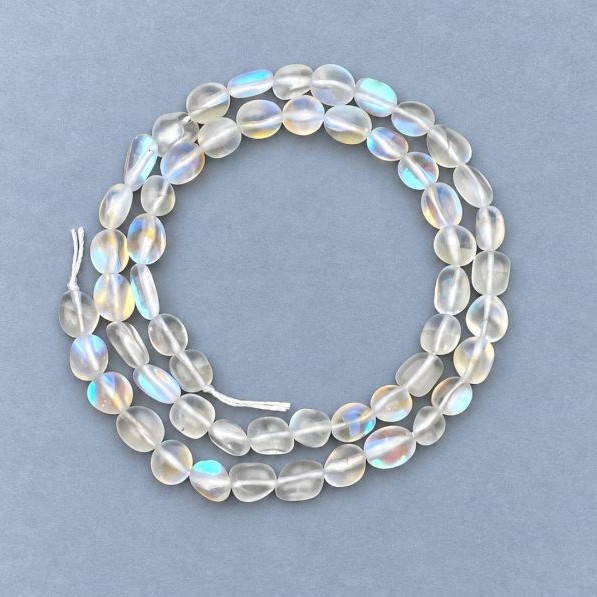 Beads on a thread of opal glass, tumbled, 6×7 mm, length 40 cm