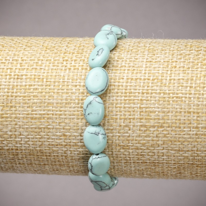Elastic bracelet with turquoise (synthetic) oval beads, diameter 10x8mm +/-, length 18cm +/-