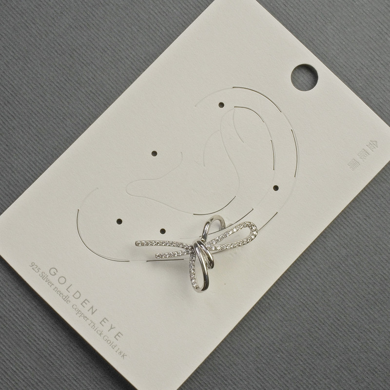 Bow Clip-On Earring in Silver Metal with White Crystals 17x30mm +/-